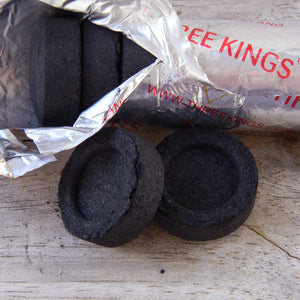 Photograph of charcoal tablets used to burn tree resins