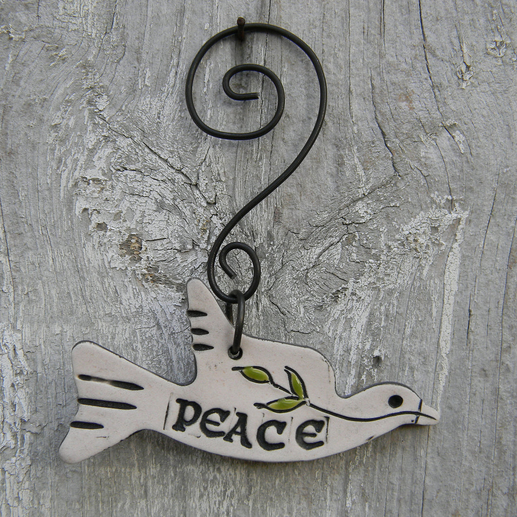 Photograph of a white stoneware peace dove